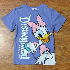 Disney Lavender Daisy Duck Graphic Tee with Pink Bow